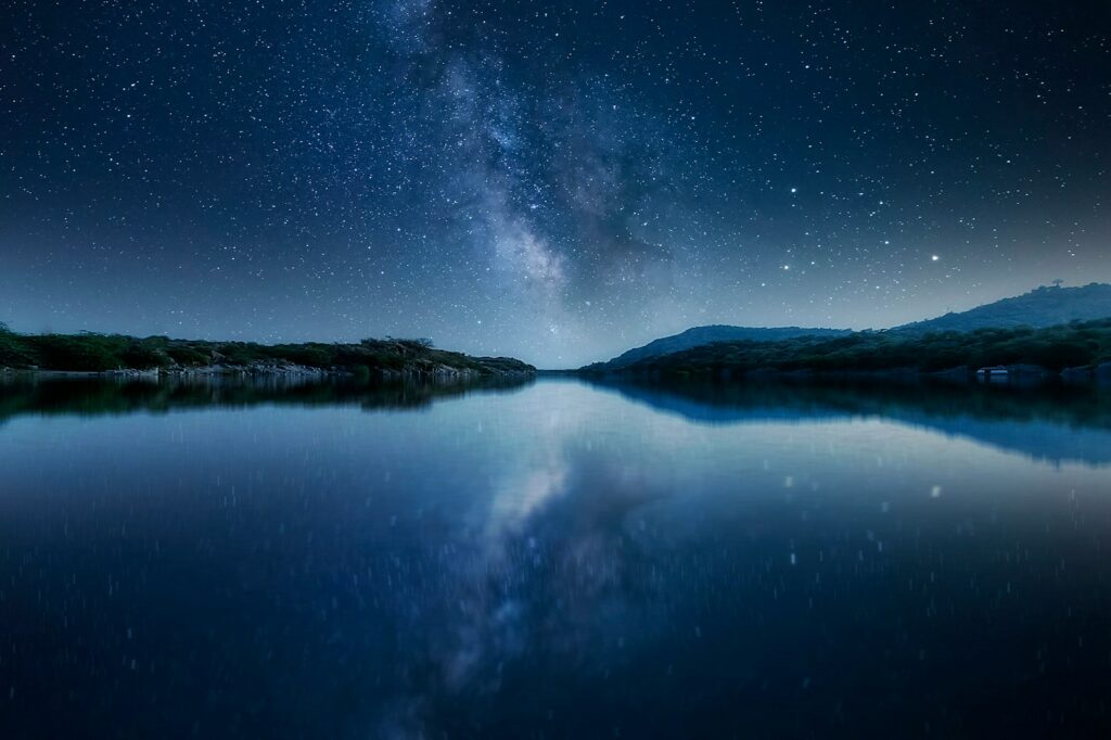 body of water under starry night